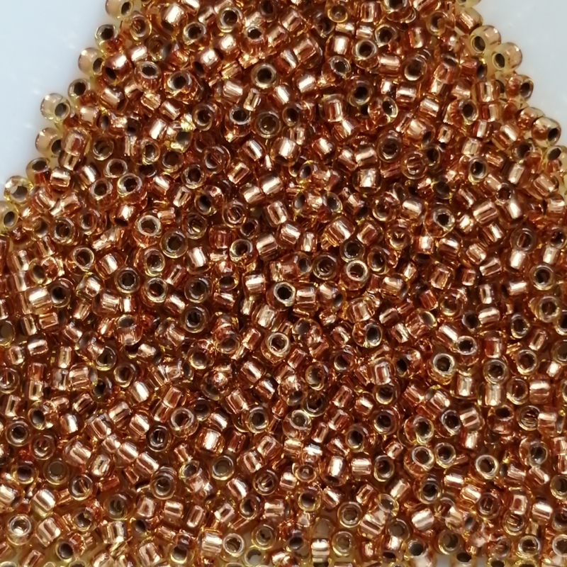 Toho 8/0 - 3 mm Copper-Lined Light Topaz