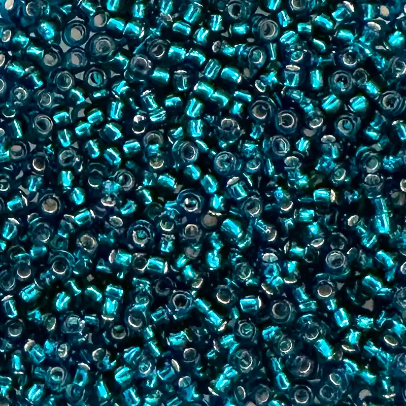 Toho Rocailles 15/0 - 1,5 mm - 5g - Farbe: 27BD Silver-Lined Teal